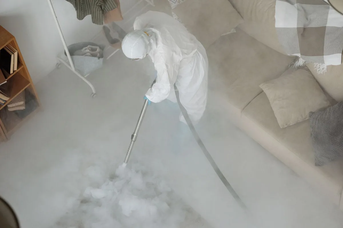 Biohazard cleanup technician in protective equipment, Sardis City, AL